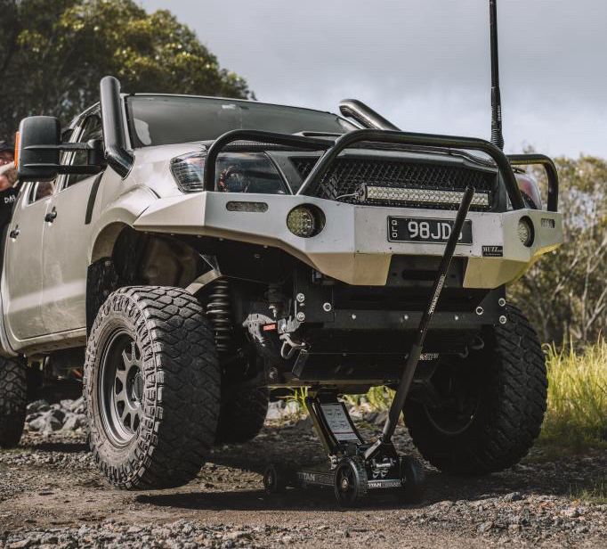 Titan Terrain rugged off-road floor jack lifting up lifted silver ute